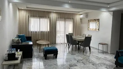 a dining room with a table and chairs at Appartement neuf luxe OLM à Rabat in Rabat