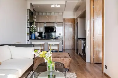 a living room with a couch and a table at Modern Ocean View Apartment in Casablanca