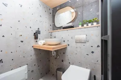 a bathroom with a sink and a mirror at So Chic & Lumineux Appartement Avec Terrasse Ensoleillée Au Coeur De Maarif Quartier Palmier Avec Parking Prés de Tramway Et Restaurants Luigi Casablanca in Casablanca