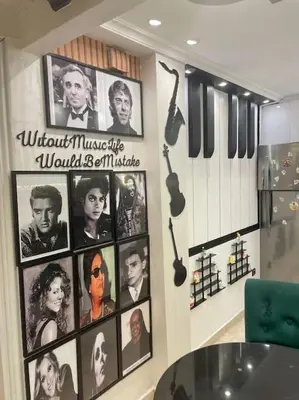 a wall with pictures of the movies on it at Spacieux appartement corniche in Casablanca