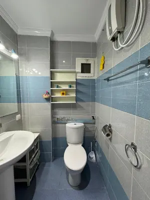 a bathroom with a toilet and a sink at SUITOUISS - Agdal 3 - Appartement à 2 minutes de la gare de train TGV Rabat in Rabat
