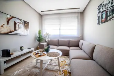 a living room with a couch and a table at Studio au coeur de Casablanca in Casablanca