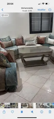 a living room with a couch and a table at Oasis beach in Mohammedia