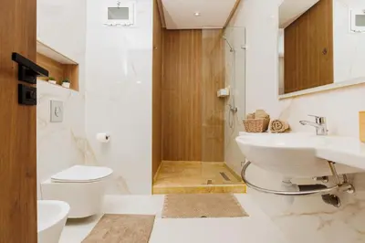 a bathroom with a toilet and a sink and a shower at Perla in Rabat
