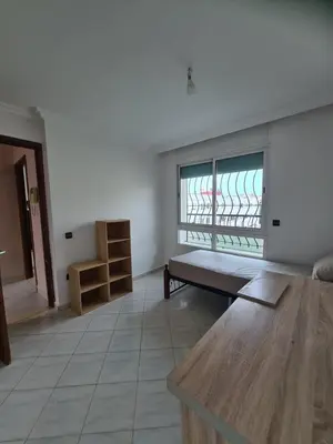 a living room with a bench and a window at Belle maison à Harhoura proche de la plage in Rabat