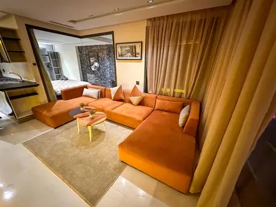 a living room with a couch and a table at Cosy in Casablanca