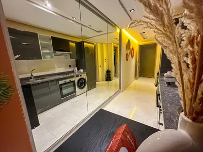 a kitchen with a glass walled kitchen with a stove at Cosy in Casablanca