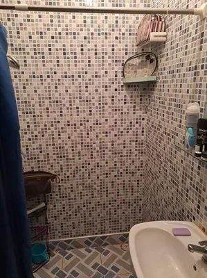 a bathroom with a sink and a tiled wall at Moonskhirat in Skhirat
