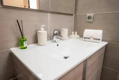 a bathroom sink with a good move sign on it at Sophisticated 3BR with Ample Space & Top Amenities in Rabat