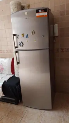 a refrigerator with magnets on it in a room at émeraude house family in Casablanca