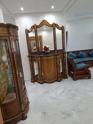 a room with some furniture and a mirror at les sables d'or in Temara