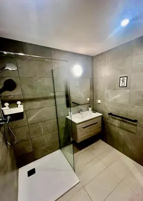 a bathroom with a sink and a shower at Cœur de Vie - Ville VERTE in Casablanca