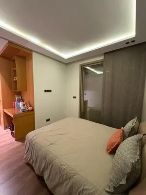 a bedroom with a large bed in a room at Apparemment luxueux casablanca in Casablanca