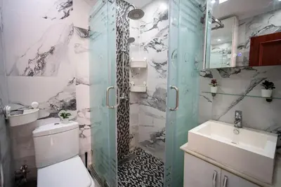 a bathroom with a shower and a toilet and a sink at Casablanca mosquée hassan 2 in Casablanca