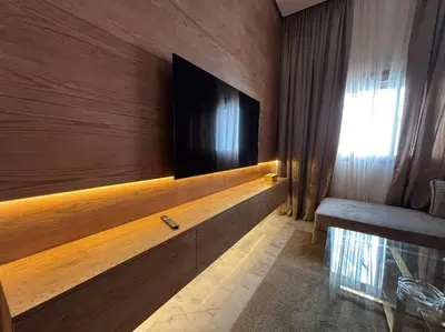 a room with a flat screen tv on a wall at Corniche Casablanca- Suite Luxueuse Gold Star in Casablanca