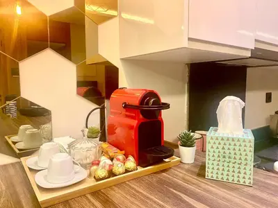 a toy kitchen with a coffee maker on a shelf at Confort & Charme à Casablanca in Maarif