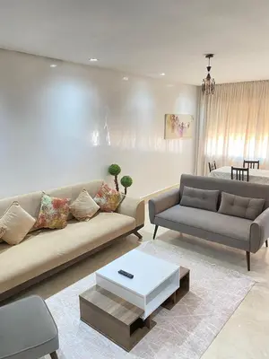 a living room with a couch and a coffee table at 2 bedroom cozy apartment ,near CFC,in center casablanca in Casablanca