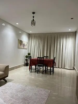 a dining room with a table and chairs in a room at 2 bedroom cozy apartment ,near CFC,in center casablanca in Casablanca
