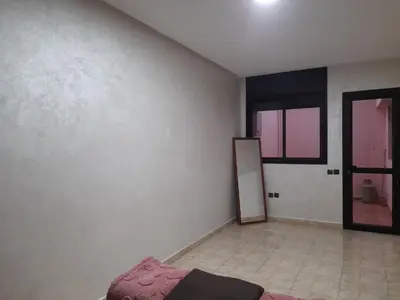 an empty room with a mirror and a room with a mirror at Apartament Ines in Skhirat