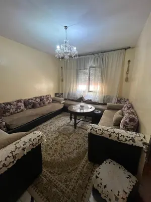 a living room with a couch and a table at Oulfa in Casablanca