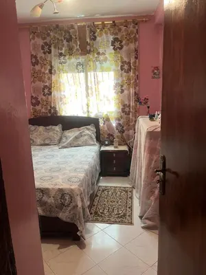 a bedroom with a bed and a window at Oulfa in Casablanca