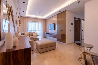 a living room with a couch and a table at Appartement Prestige et Confort in Casablanca