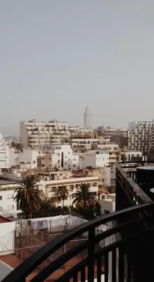 a view of a city from a balcony at Le Square By Onomo Collection in Casablanca