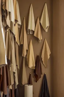 a wall with a bunch of bags hanging on a wall at Le Square By Onomo Collection in Casablanca
