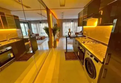 a kitchen with a washer and dryer in a room at المعاريف in Casablanca