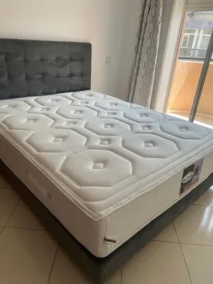 a large white bed in a room with a window at Lovely 2 bedrooms Furnished Bourgogne in Casablanca