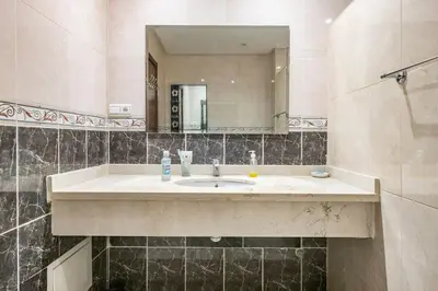 a bathroom with a sink and a mirror at Lovely 2 bedrooms Furnished Bourgogne in Casablanca