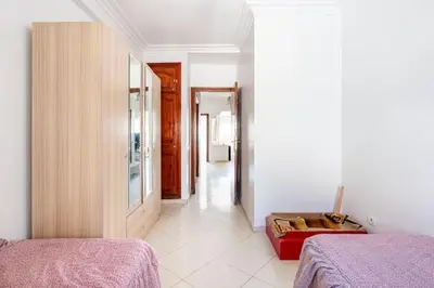 a white room with two beds and a hallway at Lovely 2 bedrooms Furnished Bourgogne in Casablanca