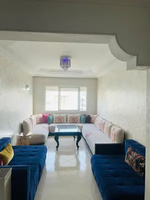 a living room with a couch and a table at Lovely 2 bedrooms Furnished Bourgogne in Casablanca