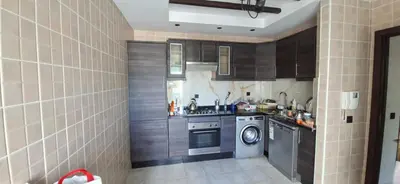 a kitchen with a washing machine and a washer at Residence la corniche d in Mohammedia