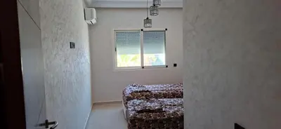 a room with a bed and a window at Residence la corniche d in Mohammedia