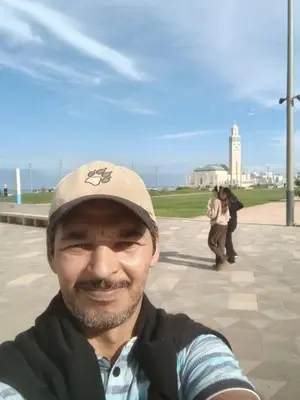 a man wearing a hat is smiling for the camera at best location single room in Casablanca
