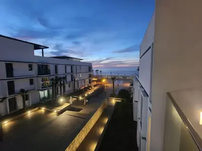 a view of a balcony of a building at night at Blue Anfa Place in Casablanca