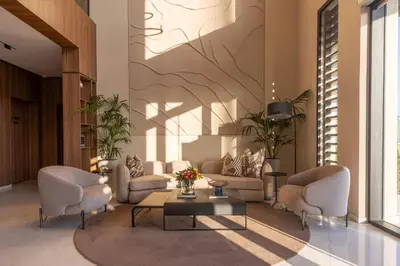 a lobby with chairs and a coffee table in a building at Citadines Almaz Aparthotel Casablanca in Casablanca