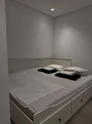 a large white bed with two pillows on it at Sunset Lover in Casablanca-Port