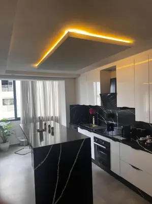 a kitchen with a black and white counter top at Sunset Lover in Casablanca-Port