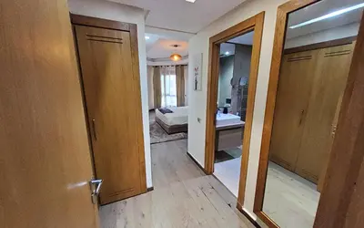 a room with a bathroom with a sink and a mirror at Appart chic vue Mer in Casablanca