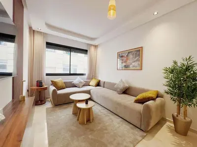 a living room with a couch and a table at Résidence Acacias Casablanca in Casablanca