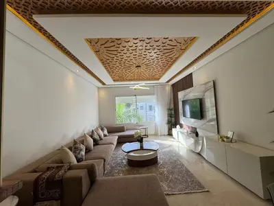 a living room with a couch and a tv at 3 Bedroom apartment near Highway with parking in Casablanca