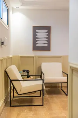 two chairs and a table in a waiting room at Stylish APPT 2 BDR Downtown of Rabat by MERAT HOME in Rabat