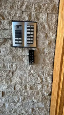 a wall with a microwave on a stone wall at Seaside studio with pool in Dar Bouazza