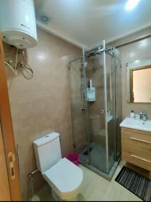 a bathroom with a shower and a toilet and a sink at Studio Haut Standing, Prix Doux ! in Casablanca