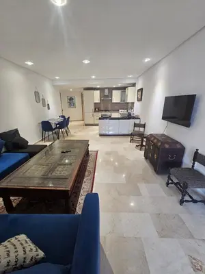 a living room with a couch and a table at Studio spacieux plein centre in Casablanca