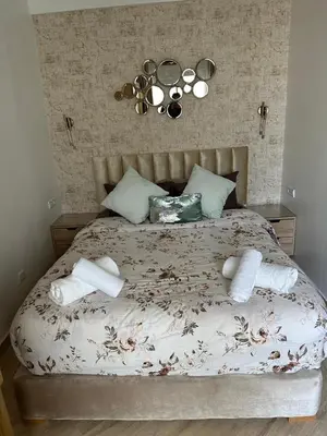 a bedroom with a bed with towels on it at AnfaSuites - Le Central - Parking Free - CasaPort 5min in Casablanca