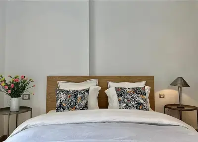 a bedroom with a bed with pillows on it at Luxurious Sea View 2 Bedroom Apartment in Anfa