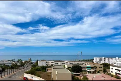 a view of a city with the ocean in the background at Luxurious Sea View 2 Bedroom Apartment in Anfa